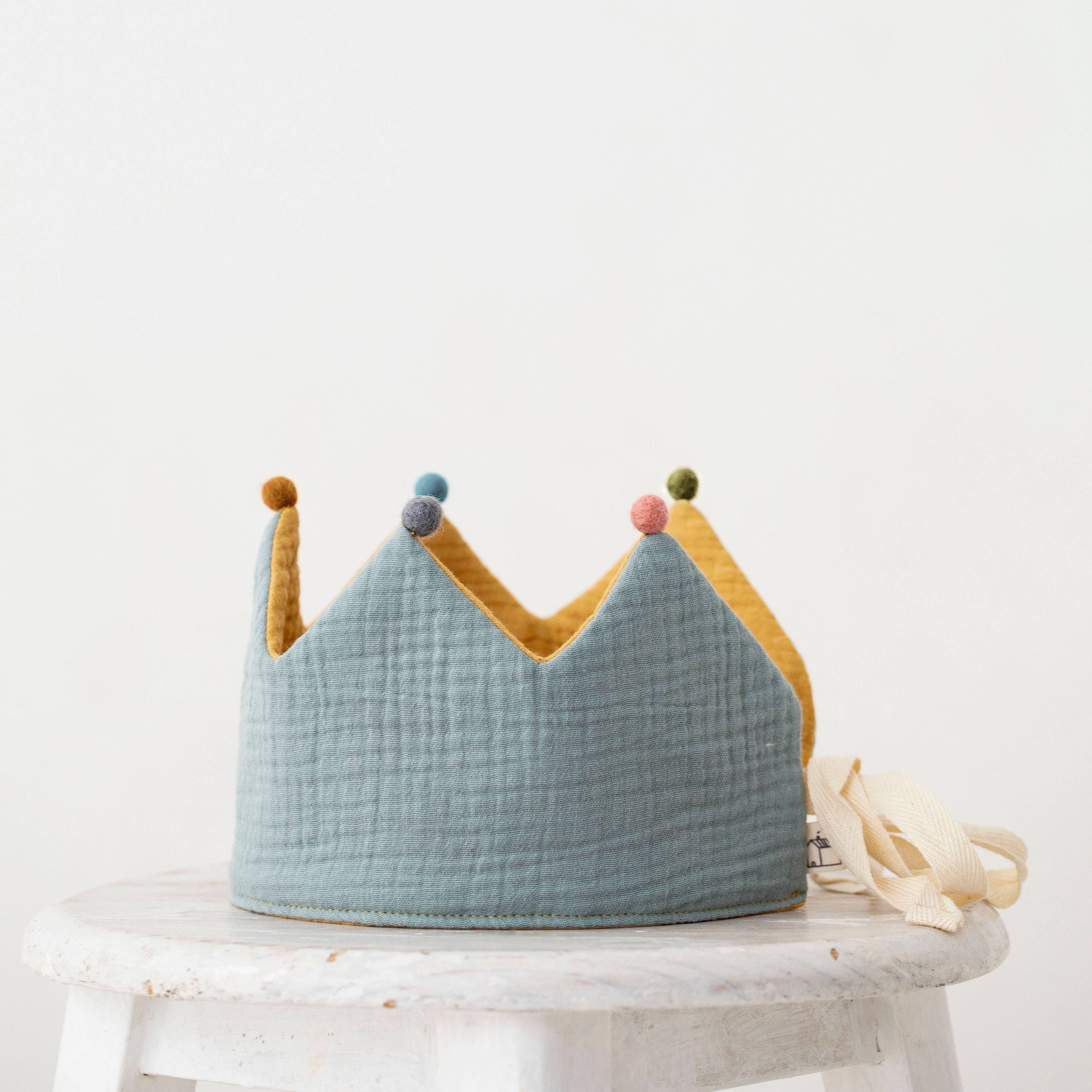 Reversible Muslin Birthday Crown - Blue, Yellow, & Pom Poms
