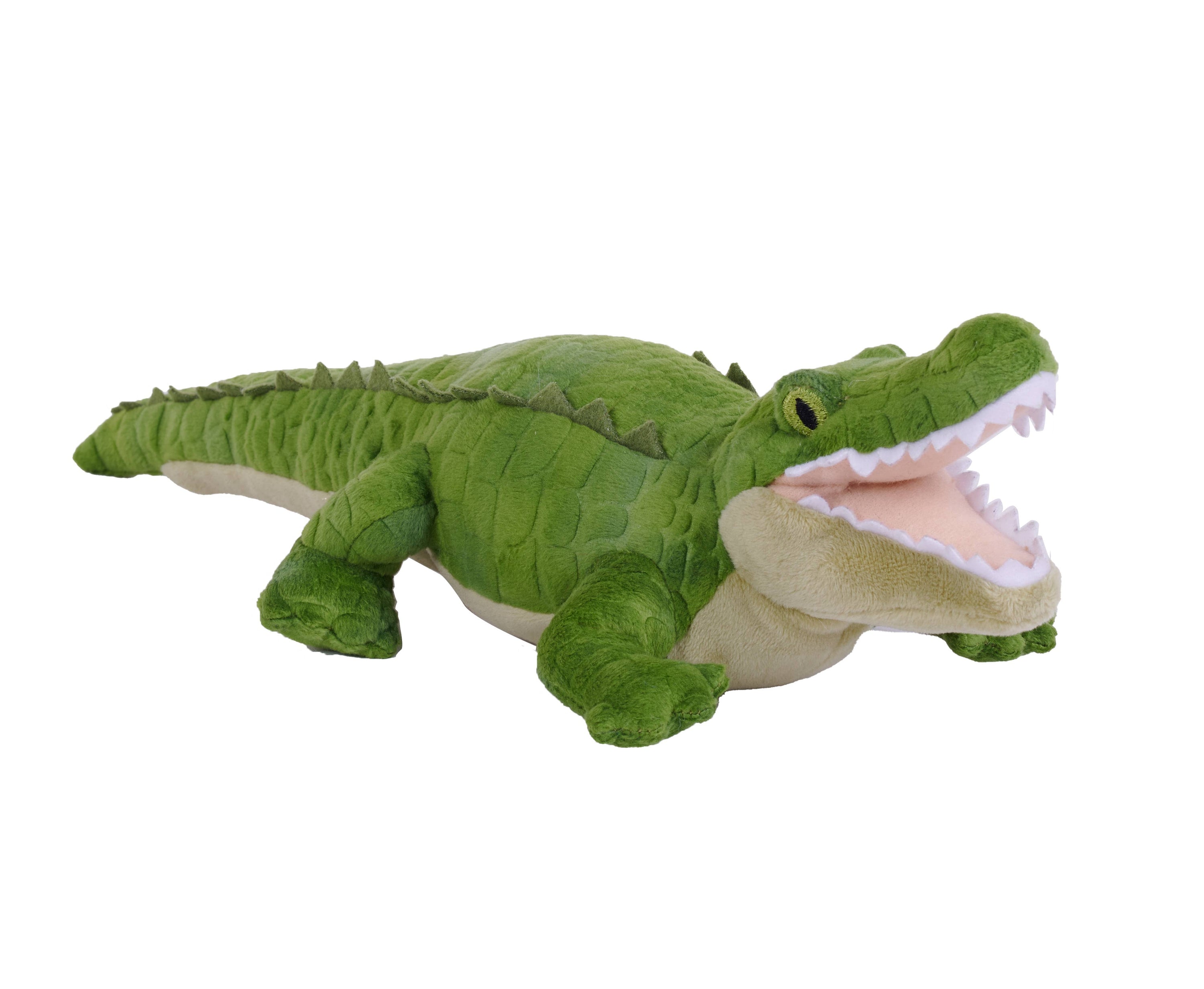 Green plush alligator toy on a white background